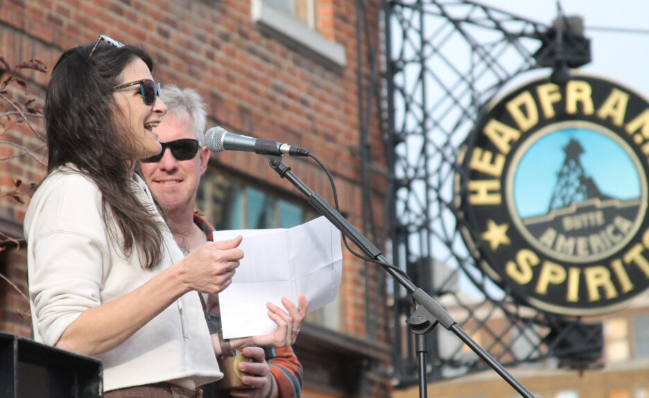 Headframe owners speak to a crowd