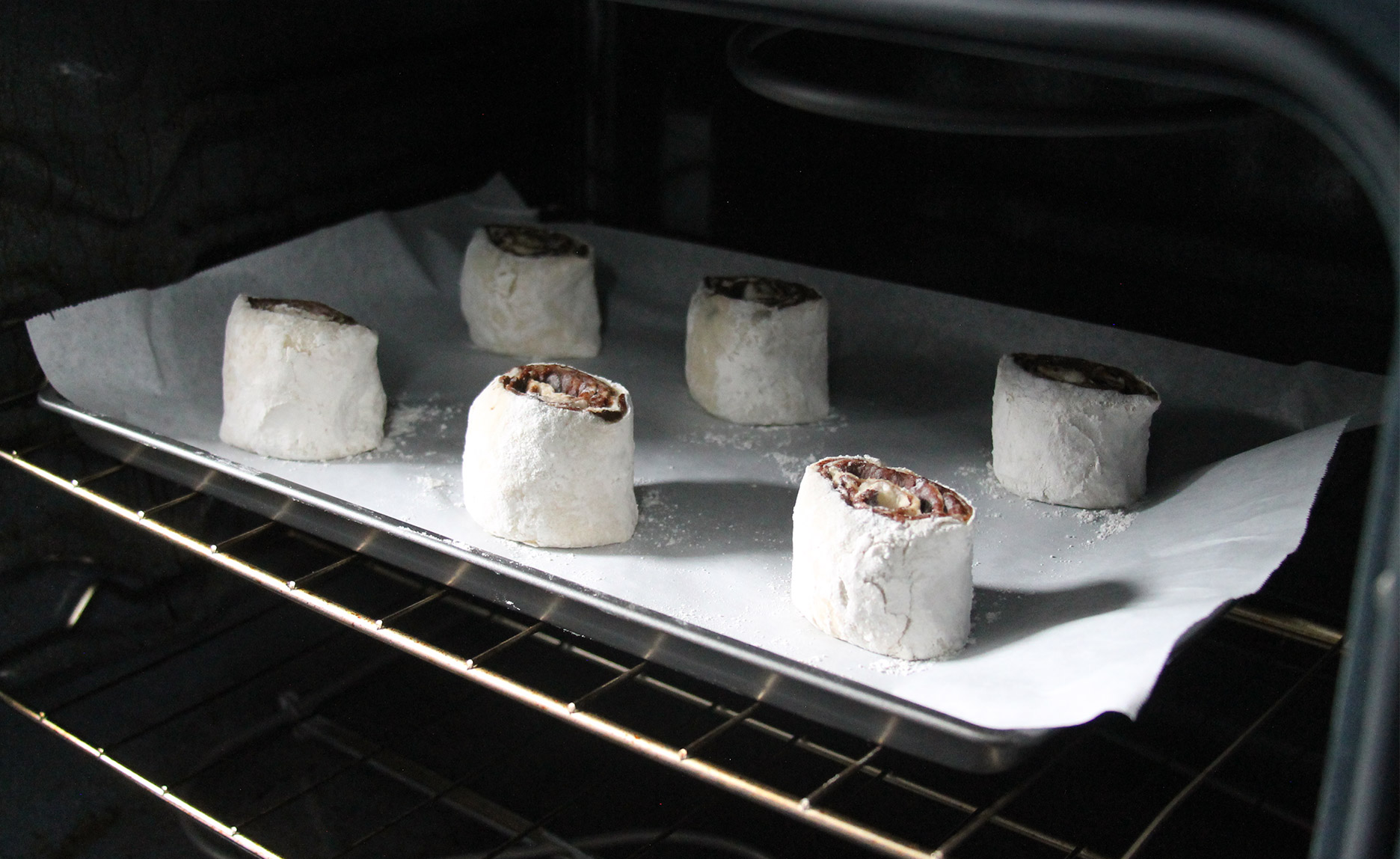 cinnamon rolls going into the oven