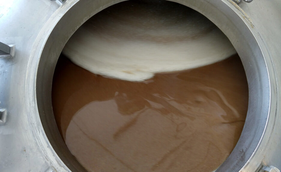 Mash and water meet inside of the mash tun before being cooked together and turned.