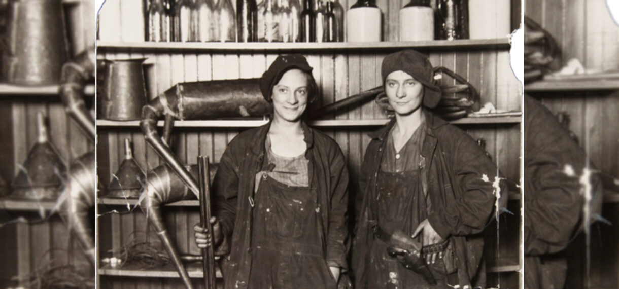 Two women moonshiners hold guns.