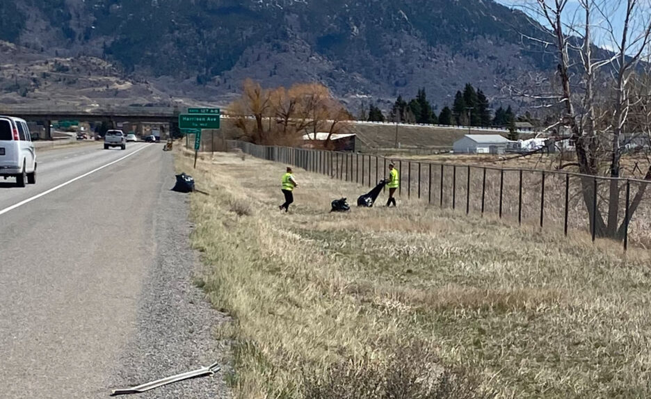 People cleaning up trash on the highway